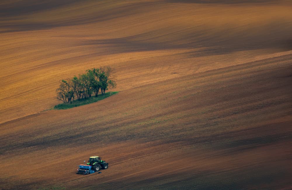 Tractor in Rolling Fields by Haim Rosenfeld — canvas wall art