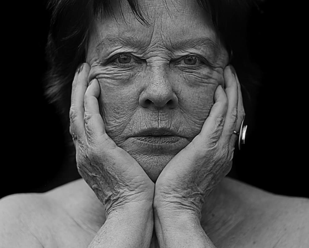 Thoughtful Older Woman by Ylva Sjögren — canvas wall art