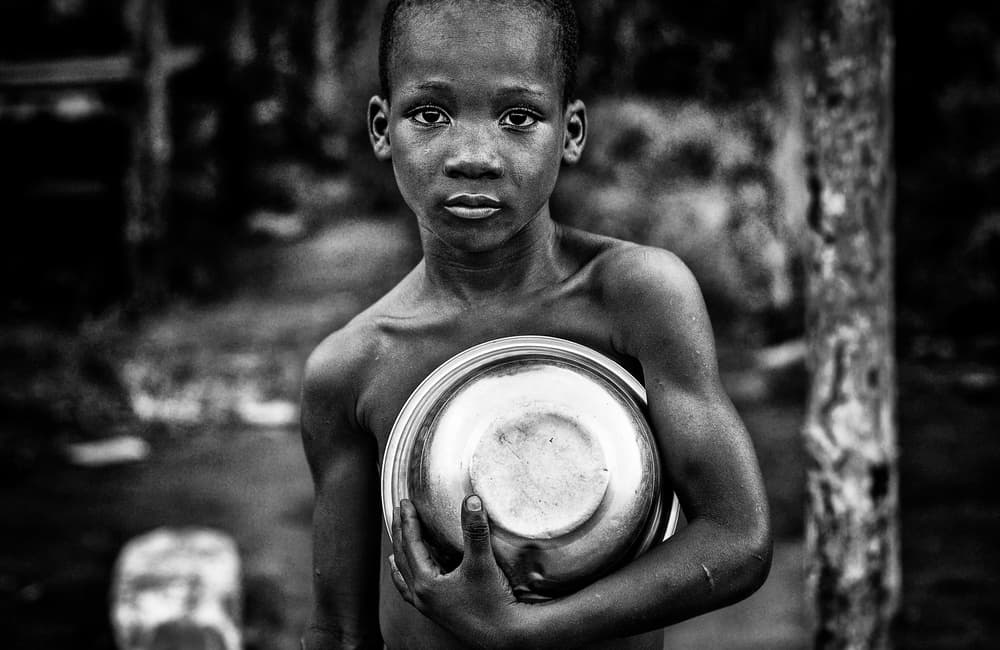 Solemn Child With Bowl by Joxe Inazio Kuesta Garmendia — canvas wall art