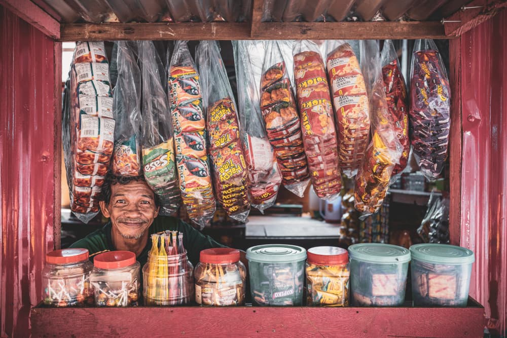 Smiling Shopkeeper by Marco Tagliarino — canvas wall art