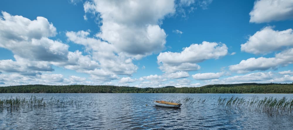 Calm Lake Rowboat by Geertjan Plooijer — canvas wall art