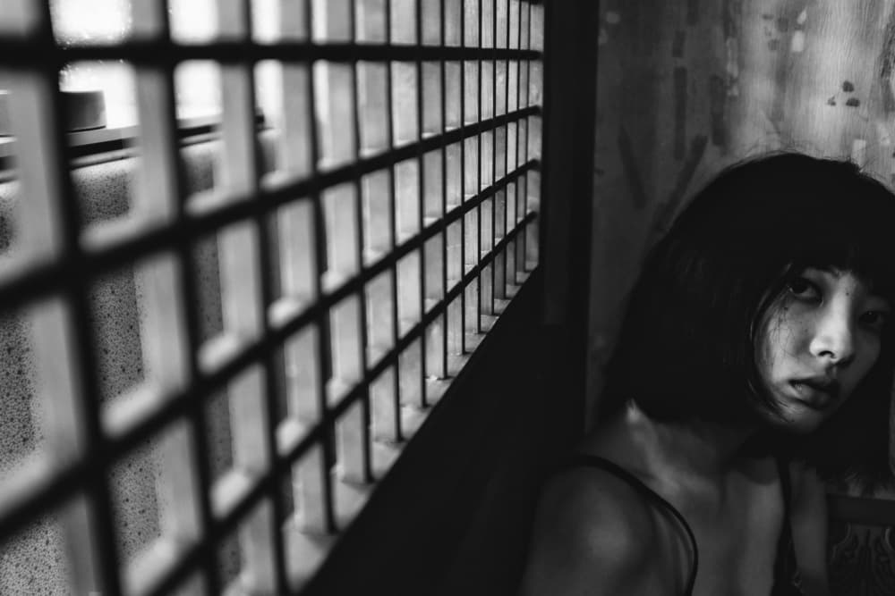 Melancholy Gaze Behind Bars by Takaaki Ishikura — canvas wall art