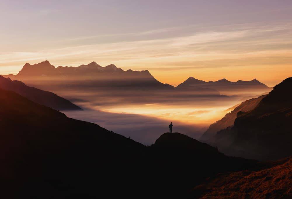 Hiker Over Misty Valley by Uschi Hermann — canvas wall art