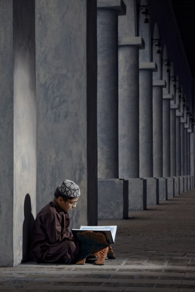 Focused Boy, Ancient Columns by Hesham Alhumaid — canvas wall art