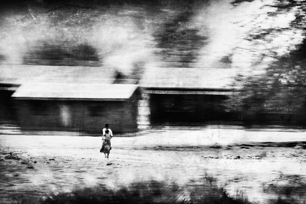 Lone Rider Past Buildings by Antonio Grambone — canvas wall art