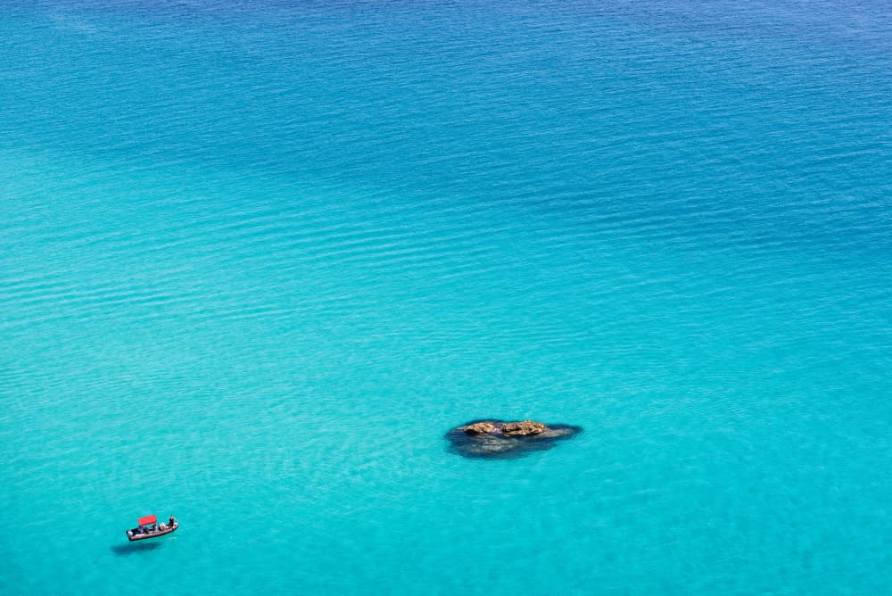 Small Boat Clear Water by Photolovers — canvas wall art