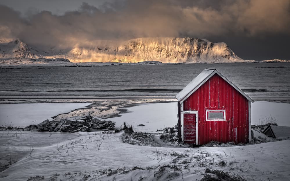 Red Cabin Snowy Shore by Juan I. Cuadrado — canvas wall art