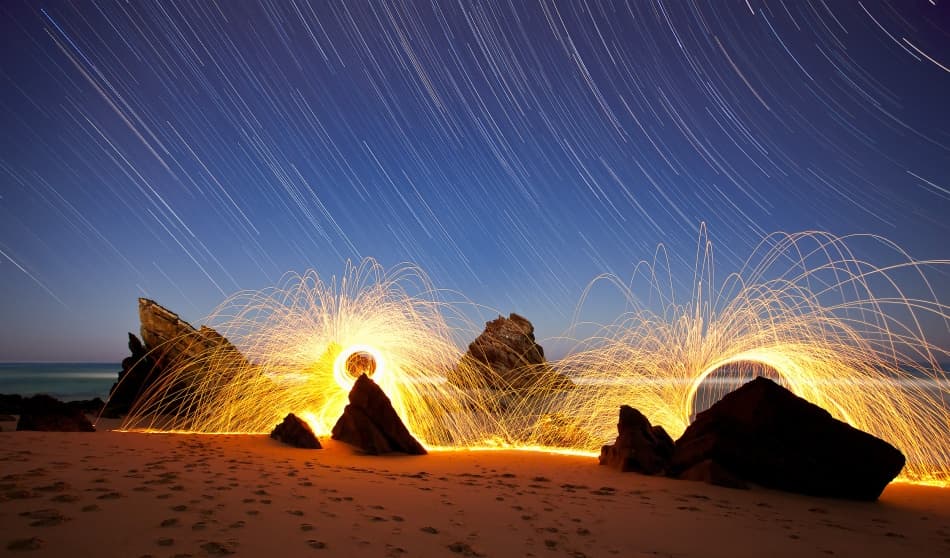 Fiery Beach Star Trails by Jorge Feteira — canvas wall art