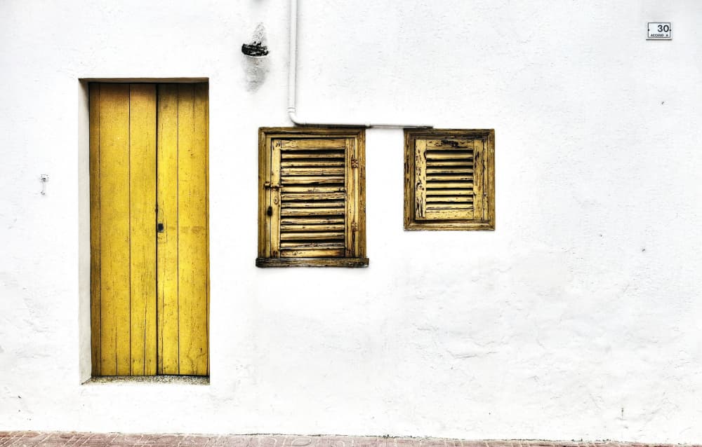 Bright Yellow Door Shutters by Hans Peter Rank — canvas wall art