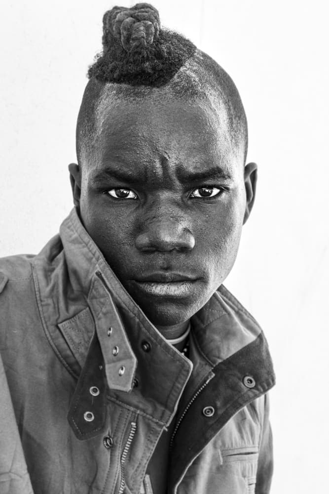 Intense Youthful Gaze by Elena Molina — canvas wall art