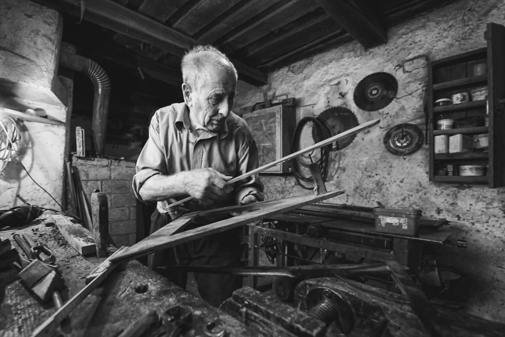 Elderly Craftsman At Work by Zoran Toldi (EFIAP AZSF) — canvas wall art