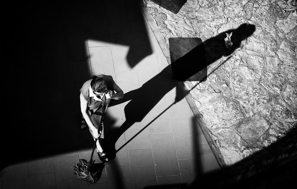 Woman Sweeping Shadows by Samanta Krivec — canvas wall art