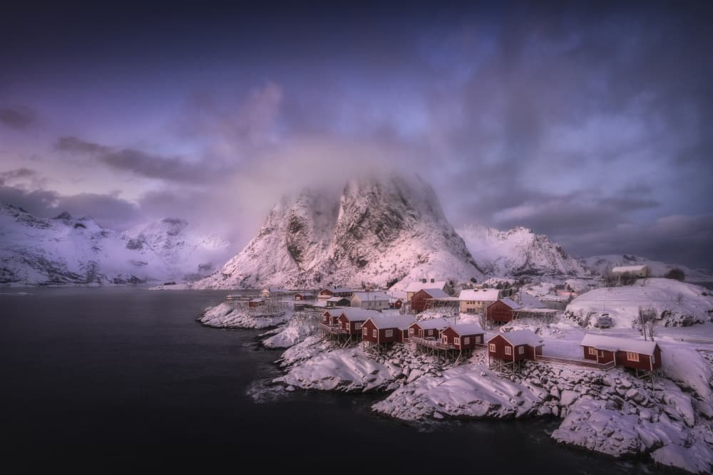 Red Cabins Winter Fjord by Carlos Gonzalez — canvas wall art