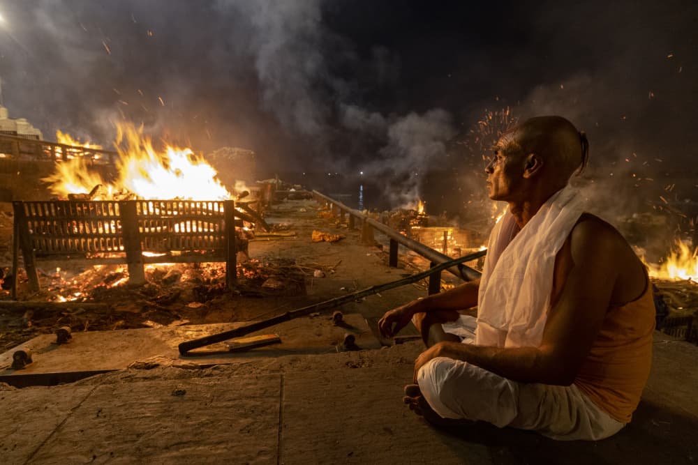 Man Amidst Sacred Flames by Azim Khan Ronnie — canvas wall art