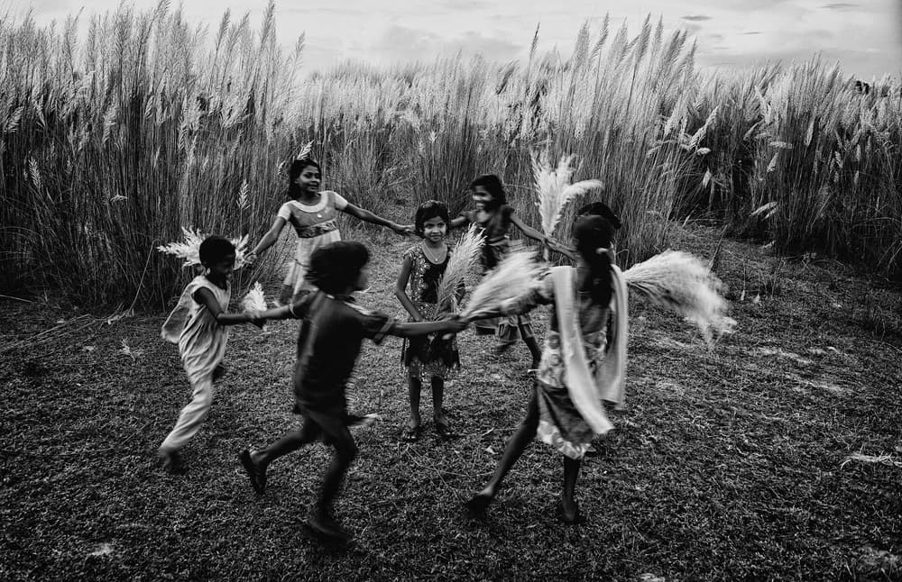 Children Dancing Field by Avishek Das — canvas wall art