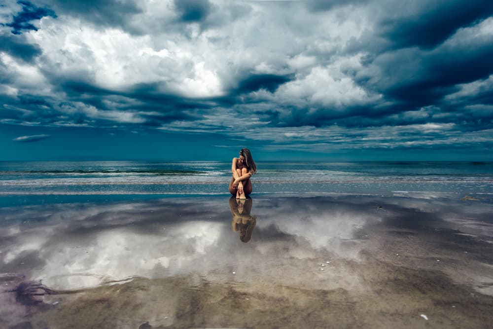 Solitary Woman Ocean Reflection by Ruslan Bolgov — canvas wall art