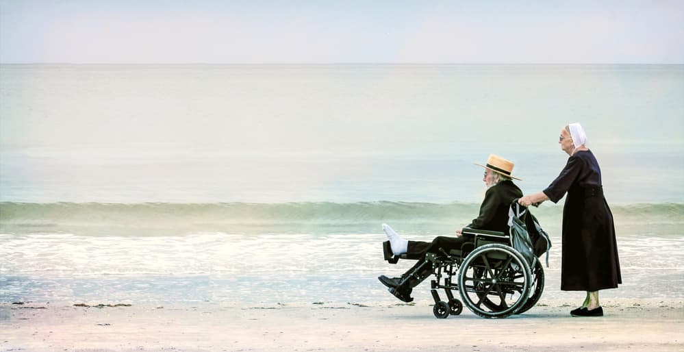 Amish Couple Beach Stroll by Jane Lyons — canvas wall art