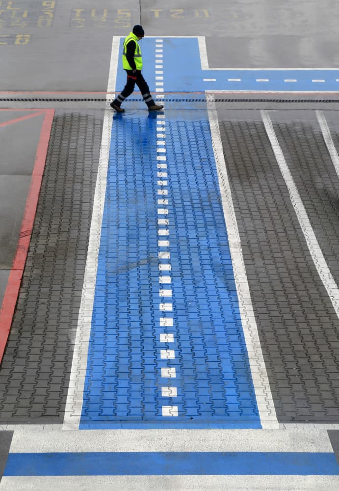 Worker on Blue Walkway by Ralitsa Byalkova — canvas wall art
