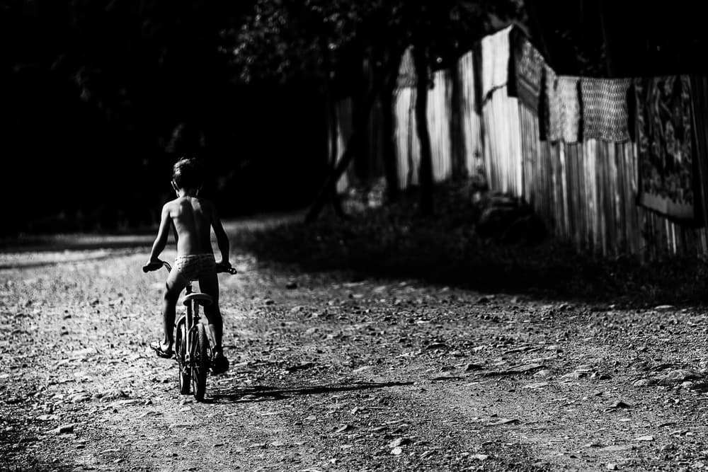 Child on Dirt Road by Marius Cinteza — canvas wall art