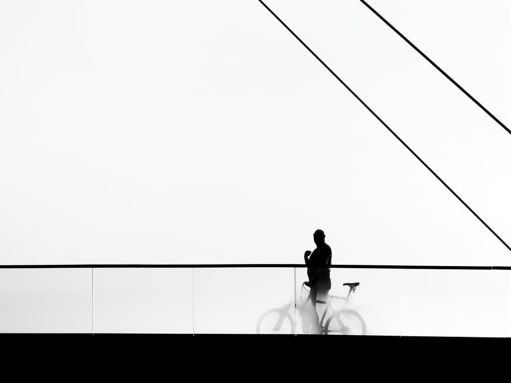 Urban Cyclist Silhouette by Marius Surleac — canvas wall art