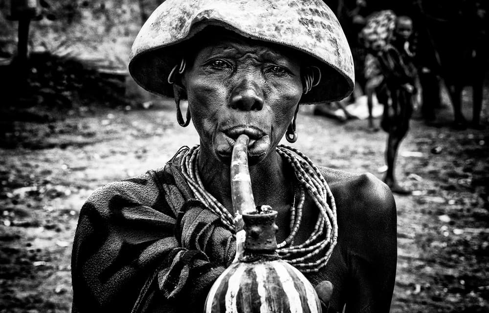 African Elder Pipe Smoker by Joxe Inazio Kuesta Garmendia — canvas wall art