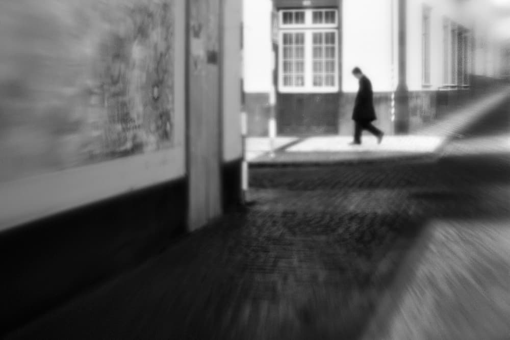 Man In Urban Blur by Paulo Abrantes — canvas wall art