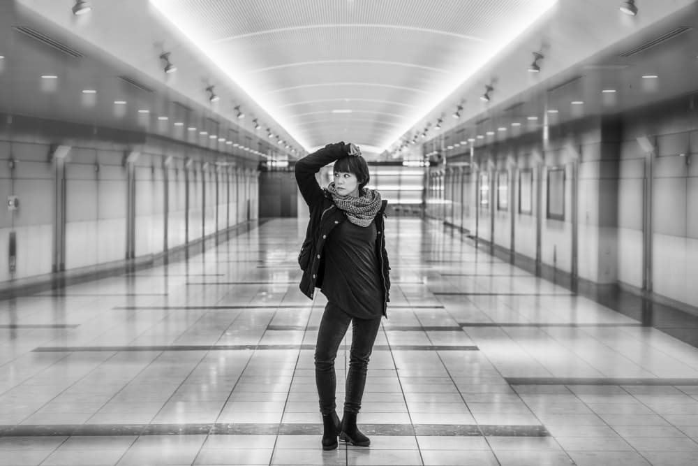 Stylish Woman Urban Hallway by Tomoshi Hara — canvas wall art