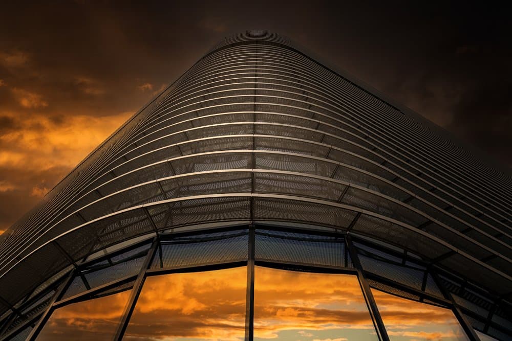 Curved Building Sunset by Roland Weber — canvas wall art