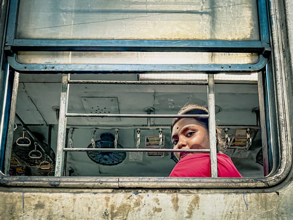 Woman in Train Window by Subhajit Das — canvas wall art