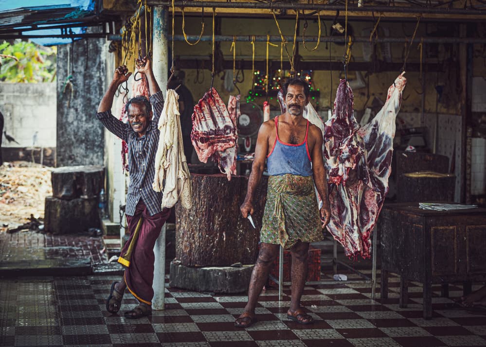 Smiling Indian Butchers by Marco Tagliarino — canvas wall art
