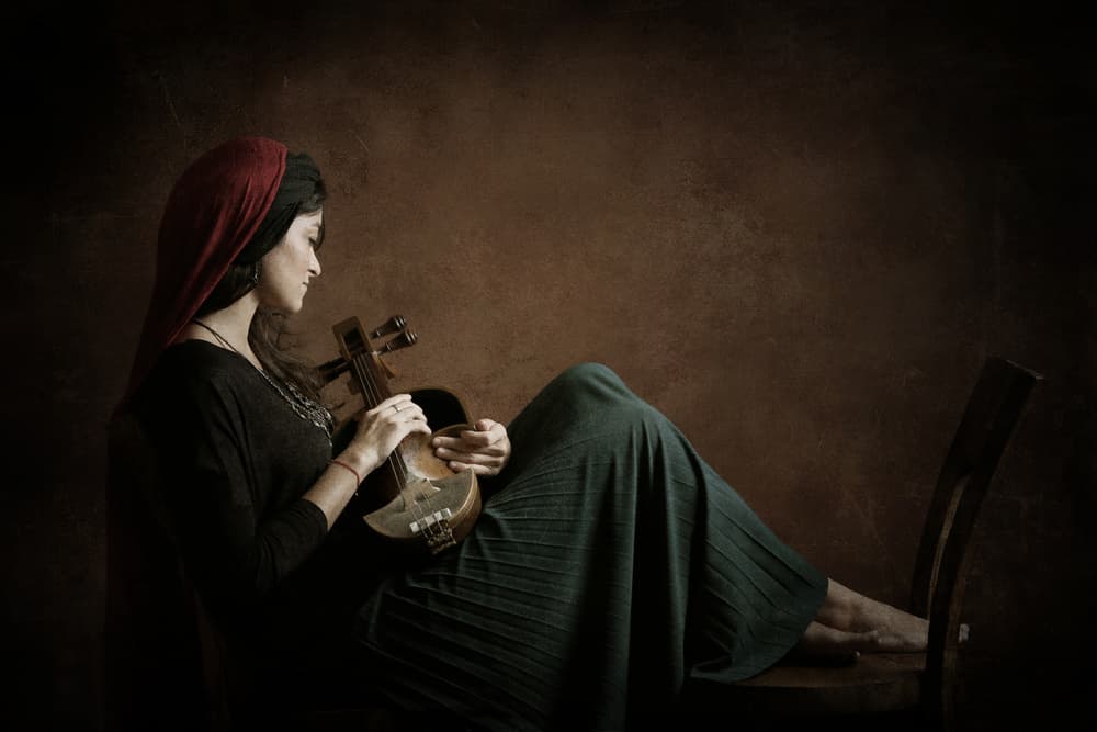 Contemplative Musician by Moein Hasheminasab — canvas wall art