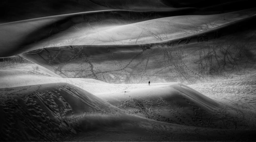 Lone Figure Snow Dunes by Lior Yaakobi — canvas wall art