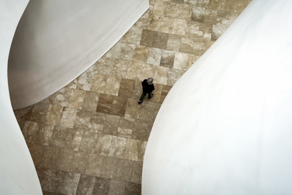 Man Walking Modern Architecture by Linda Wride — canvas wall art