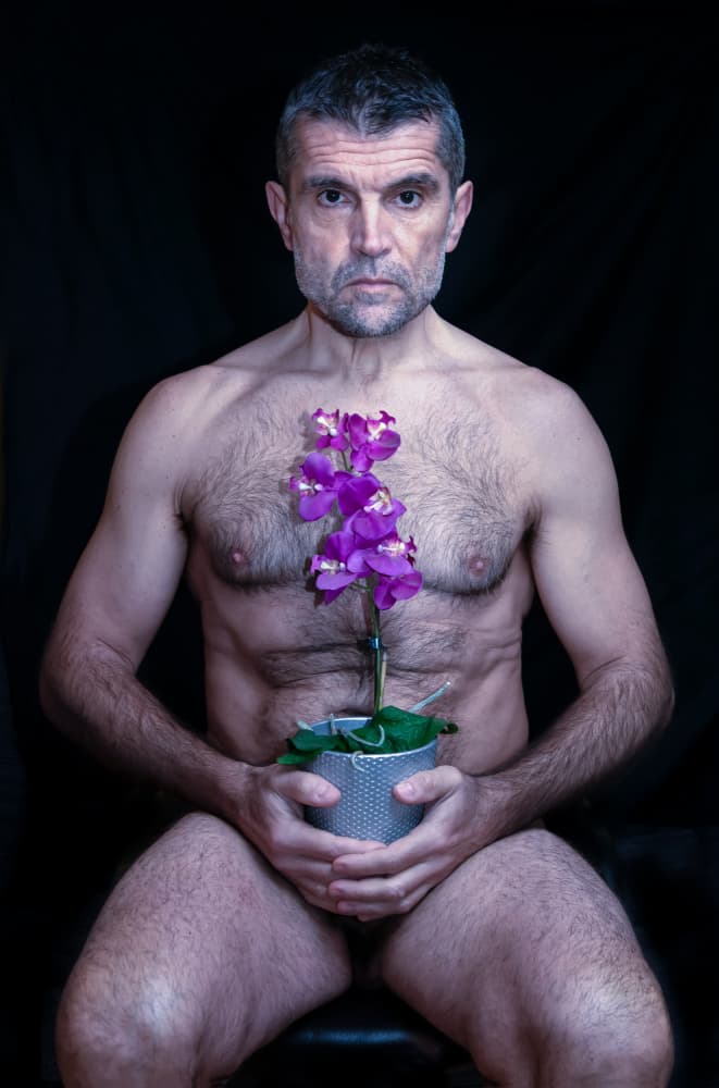 Thoughtful Man with Orchid by Giorgio Toniolo — canvas wall art