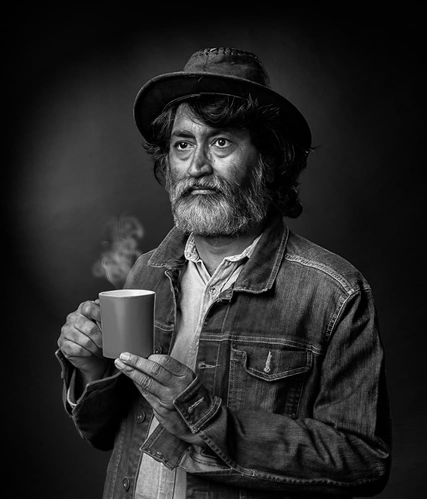 Thoughtful Man With Coffee by PARTHA BHATTACHARYYA — canvas wall art
