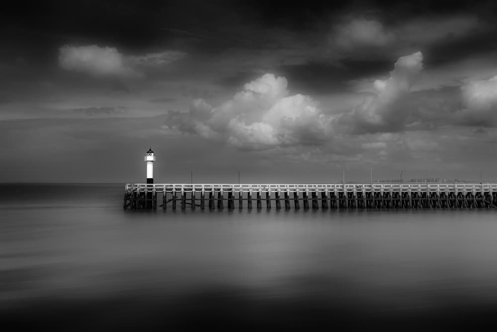 Moody Lighthouse Pier by Marc Huybrighs — canvas wall art