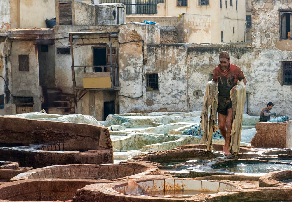 Fes Tannery Worker by Andrei Nicolas - The Traveler — canvas wall art