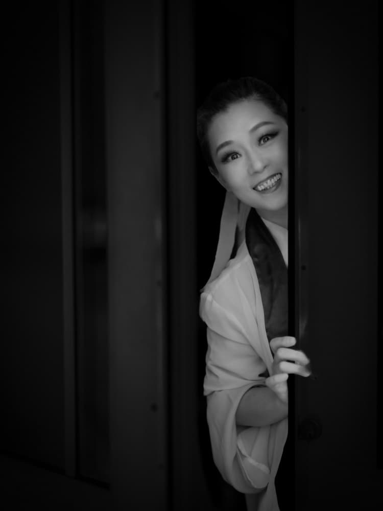 Smiling Performer Peeks by Jeff Wang — canvas wall art