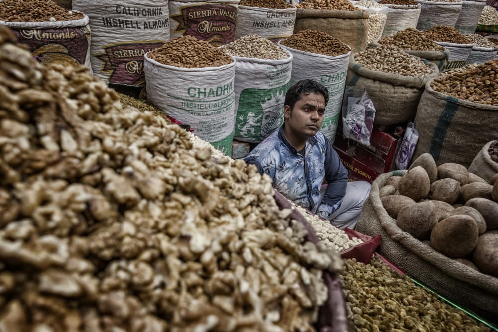 Market Nut Vendor by Pavol Stranak — canvas wall art
