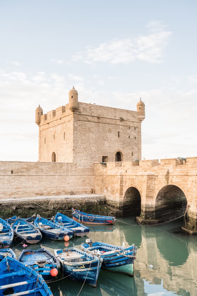 Essaouira Fort And Blue Boats by Photolovers — canvas wall art