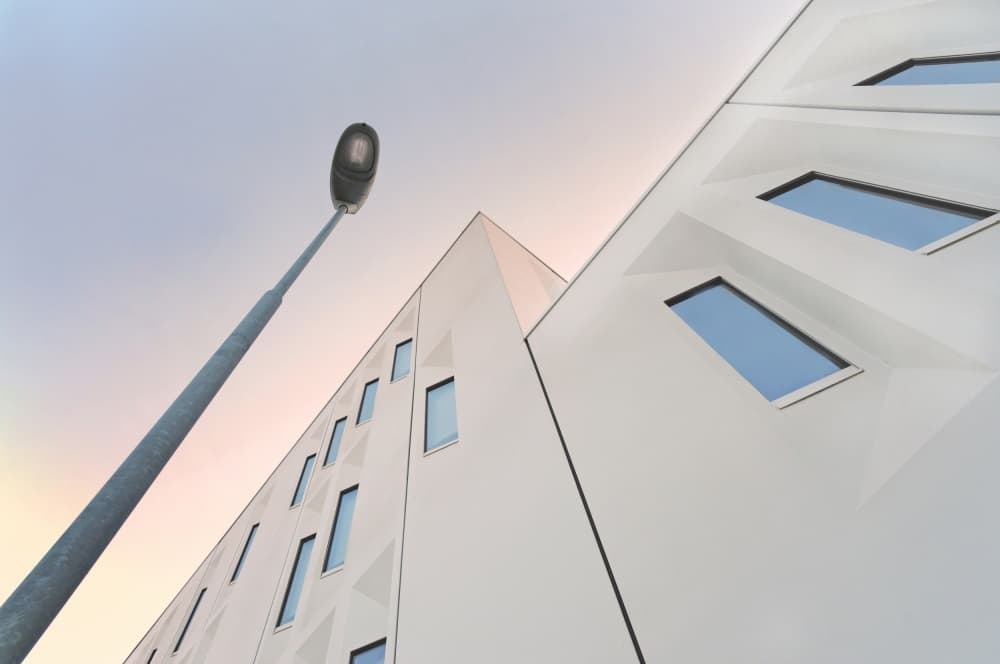 Modern Building Sunset by Lou Urlings — canvas wall art