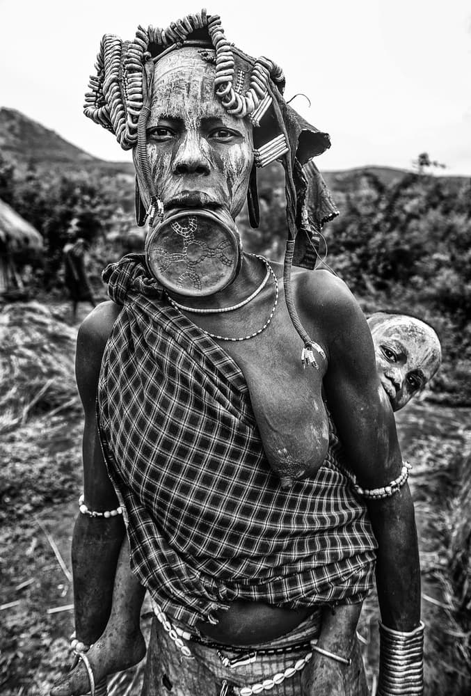 Tribal Mother And Child by Joxe Inazio Kuesta Garmendia — canvas wall art