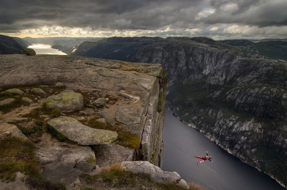 Cliff Jump Over Fjord by Wojciech Kruczynski — canvas wall art