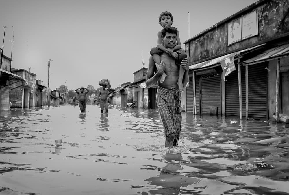 Father and Son Flood by Avishek Das — canvas wall art