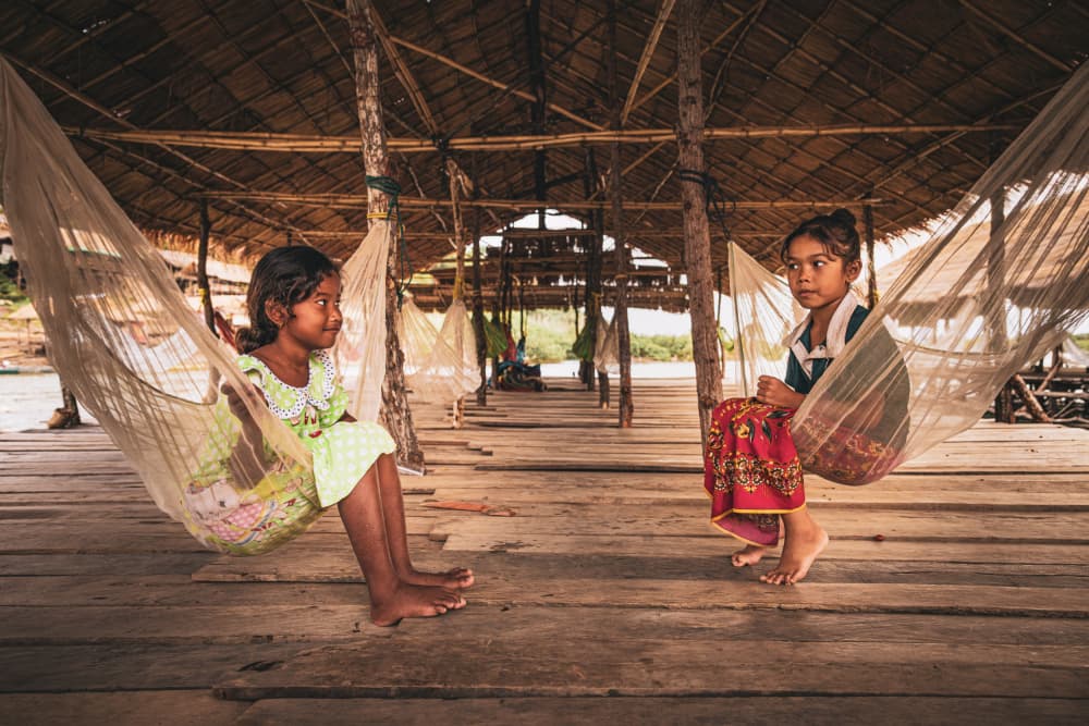 Smiling Hammock Girls by Marco Tagliarino — canvas wall art