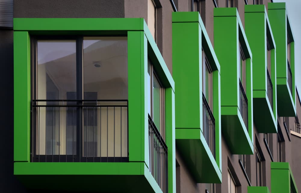 Vibrant Green Balconies by Hans-Wolfgang Hawerkamp — canvas wall art