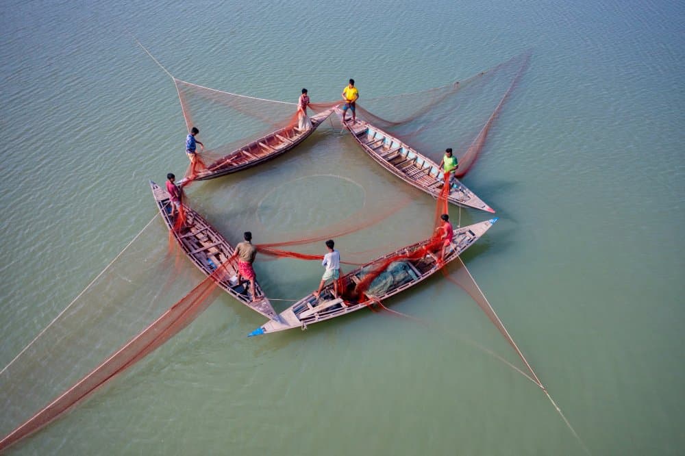 River Fishermen Casting Nets by Azim Khan Ronnie — canvas wall art