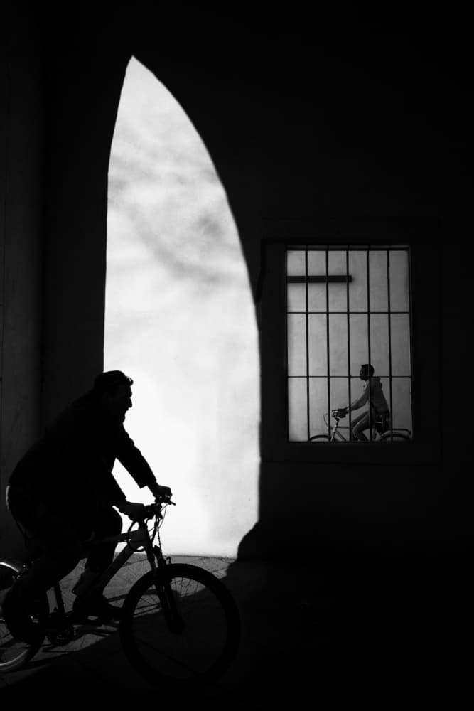 Cyclist in Light and Shadow by Massimo Della Latta — canvas wall art