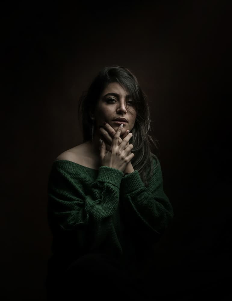 Thoughtful Woman Green Sweater by Moein Hasheminasab — canvas wall art