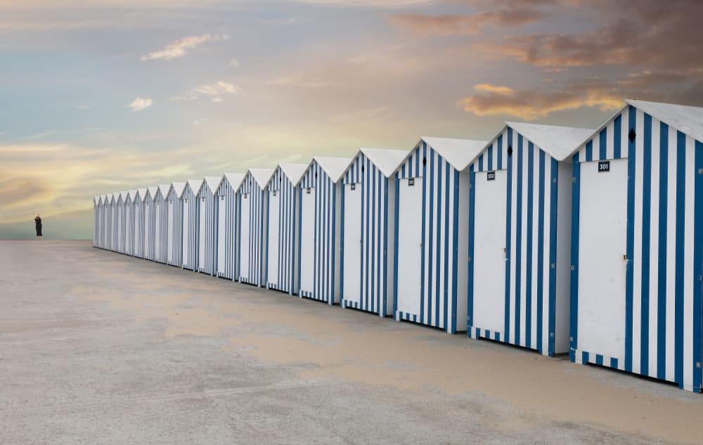 Long Row Beach Huts by Uschi Hermann — canvas wall art